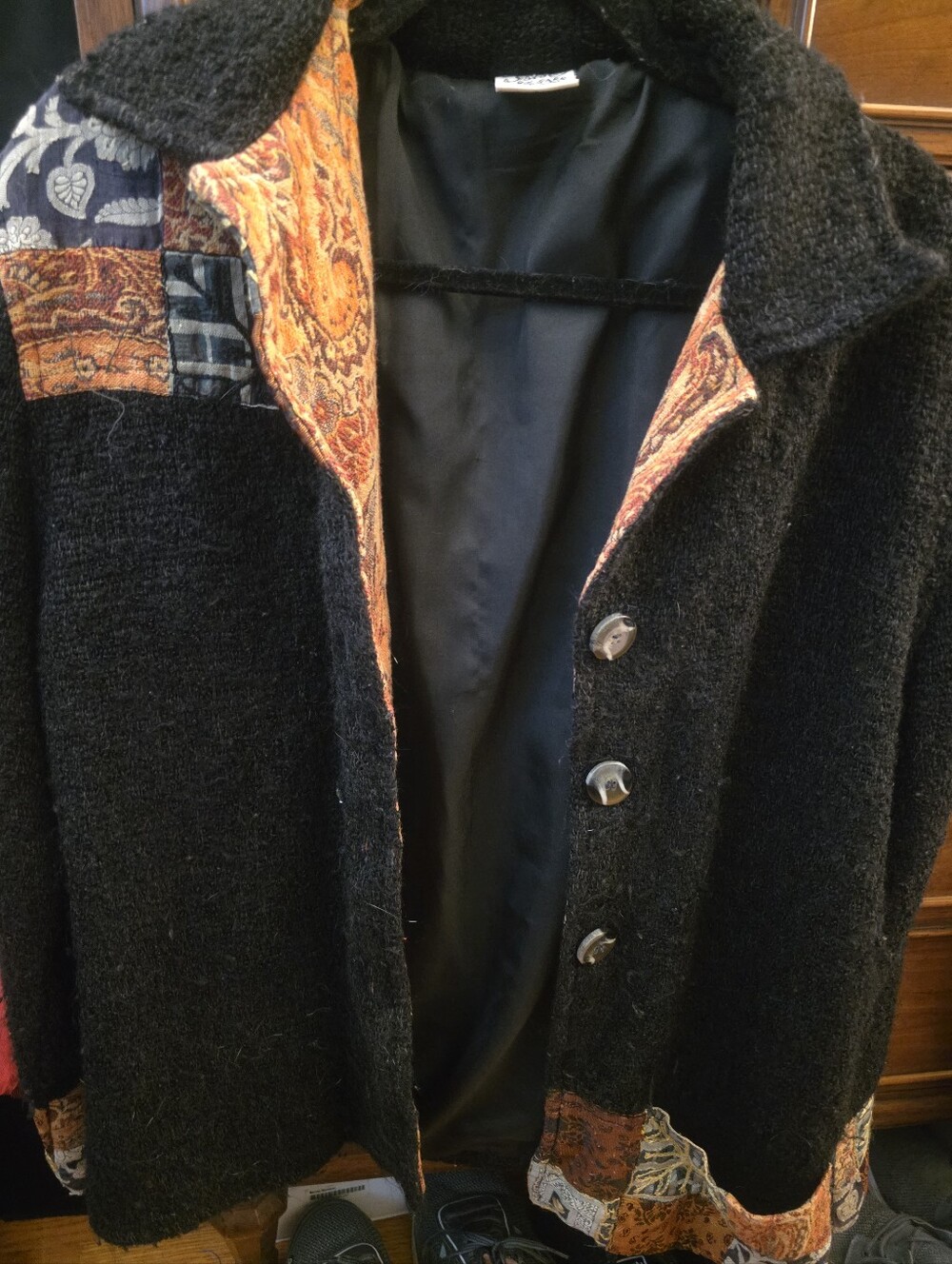 Black Woman Textured Coat with Paisley Trim